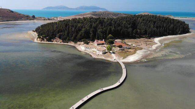 Drone aerial view on isolated Monastery of Saint Mary on Zvernec island. Narta Lagoon, Vlore, Albania