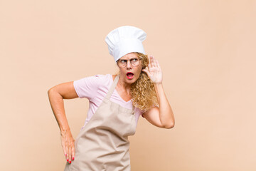 middle age woman baker looking serious and curious, listening, trying to hear a secret conversation...