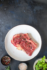 rib eye steak meat beef fresh juicy on the table serving portion size top view place copy space for text