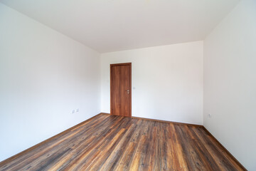 Empty bright living room. New home. Beautiful apartment interior. Wooden floor