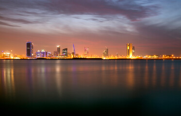 Dramatic hue in the sky amd Bahrain skyline at sunset