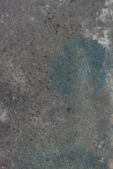 Vertical concrete grey spotted surface with blue  color for background