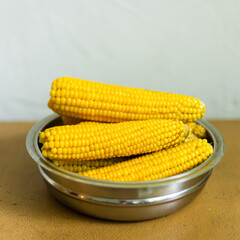Boiled corn in a steel bowl