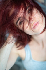 Beautiful young stylish ginger woman with freckles. Fashion portrait of charming girl wearing...