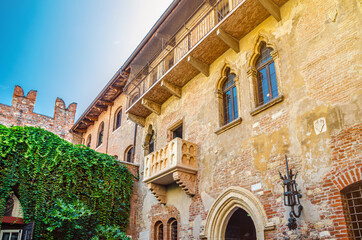 Fototapeta na wymiar Casa di Giulietta with Juliet balcony, Juliet Capulet house courtyard and Teatro Nuovo theatre in Verona