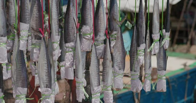salted fish hanging on the boat