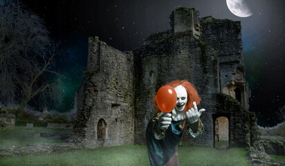 eerie clown with an ballon attracts the viewer