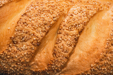 close up view of fresh baked bread crust with sesame