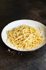 spaghetti pasta plate macaroni semola durum wheat on the table serving portion size top view place copy space for text