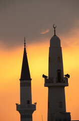 Minarets at sunrise a view from Busiateen coast, Bahrain