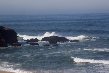 Rocks greeting the waves