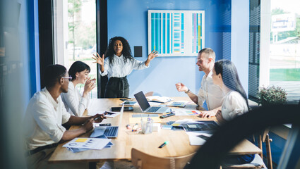 Delighted colleagues making plans in office