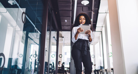 Professional female employee using tablet during break