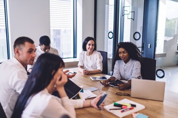 Modern diverse colleagues in conference room