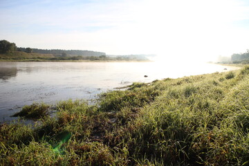 View of the misty river from the morning in summer