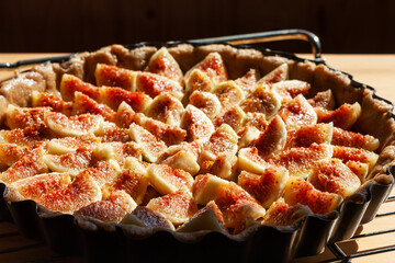Home made figs pie un the sunlight on the table. Healthy eating sweet organic food concept....