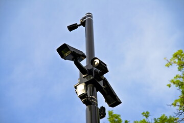 Surveillance cameras and sensors on a pole.