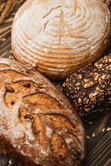 close up view of fresh baked bread loaves on wooden surface