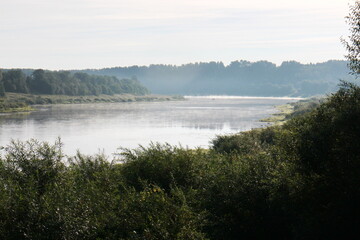 Fototapeta premium View of the misty river from the morning in summer