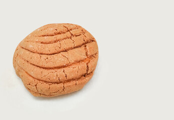 sweet bread called concha de chocolate, mexican bakery, white background. copy space