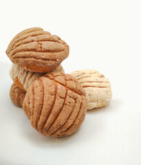 heap of sweet bread called conchas, mexican dinner.