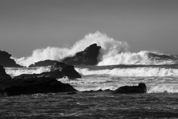 Surf breaking on a rocky shore