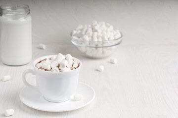 White cup full of homemade caco drink usually cooked at hold winter vacations served on plate with...