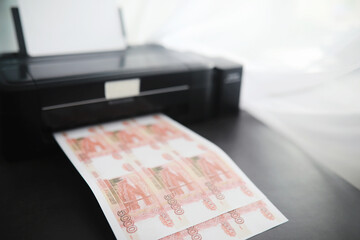 The concept of the global economic crisis. Illegal production of money, the inscription on the bill...