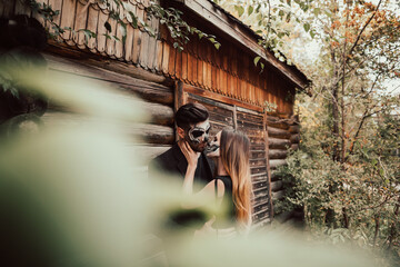 Halloween couple. Holiday traditional symbols. Wooden background. Halloween concept.