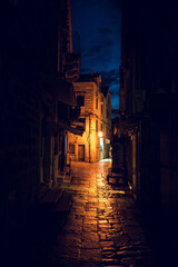 Fototapeta na wymiar Narow stone mediterranean street
