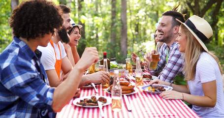 Friends having a barbecue party in nature