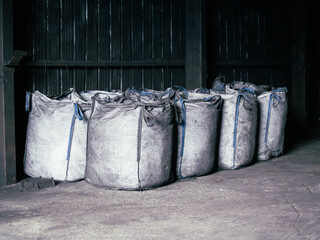 Full Cloth Fuzzy White Agricultural Charcoal Bags, Stand in a Row, black background