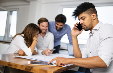 Group of business people meeting in office, sharing their ideas.