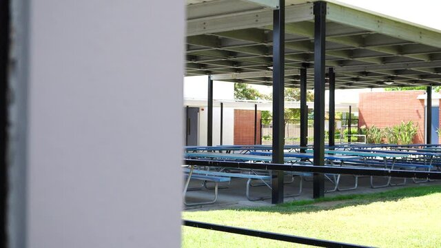 Closed Empty Elementary School Lunch Area with Tables