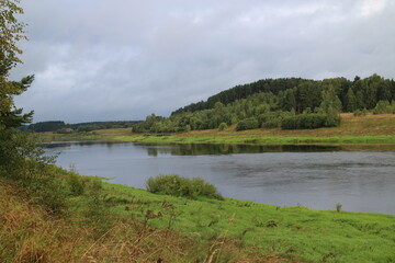 View of the river in the countryside at sunset