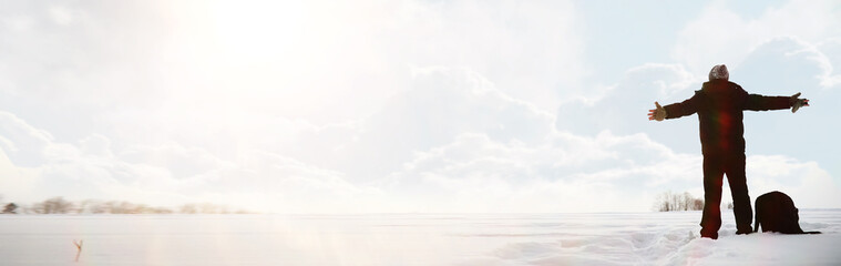 A man on a walk. Winter landscape. Tourist in winter journey.