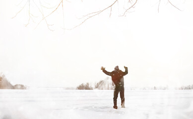A man on a walk. Winter landscape. Tourist in winter journey.