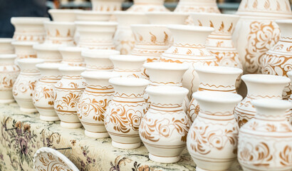Happy colorful ceramics. Traditional Romanian handmade ceramics market at the potters fair from...