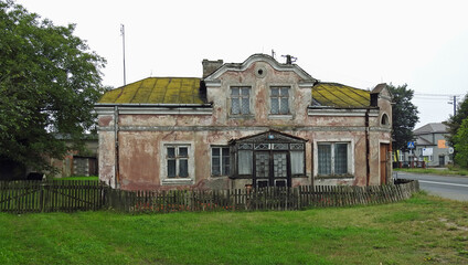 Fototapeta na wymiar uninhabited, ruined abandoned house on the street in church lipowiec in mazovia, poland