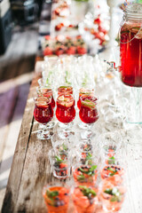 Top view of assortment of alcohol free drinks on wedding celebration. Sober party with delicious cocktail. variety of tasty lemonade and juice. Luxury birthday party. Concept of bar and healthy life.