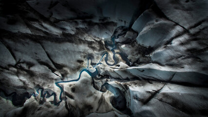 glacial river on iceberg from above