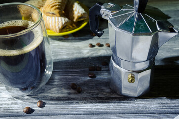 Cake still life with cup of coffee highlighted of sunlight