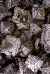super macro shot of big exotic spice black  charcoal flakes salt from Cyprus in detail very close. Ideal food and spice background