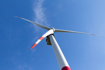 wind turbine on blue sky, alternative energy source concept