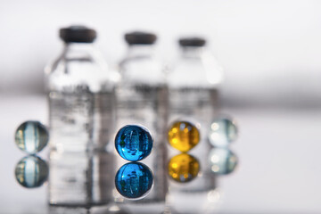 Set of transparent medical bottles and bottles with liquid with different transparent balls.