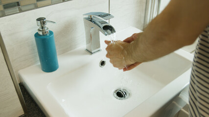 Washing hands intensively close up in a modern bathroom