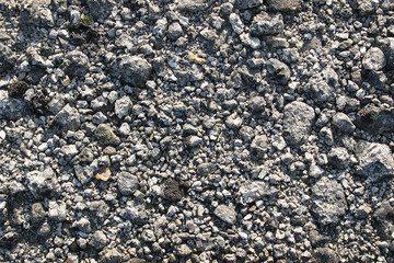 Crushed stone background. Small rocks on a mountain trail