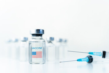 Transparent vials with USA, american flag. Vaccine, syringes for covid-19 coronavirus, flu, infectious diseases.Injection after clinical trials for vaccination of human, people.Medicine, drug concept