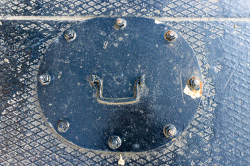 Closed tank lin on black barge. Confined space, manhole.