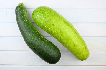 Homegrown zucchini on vintage white wooden table